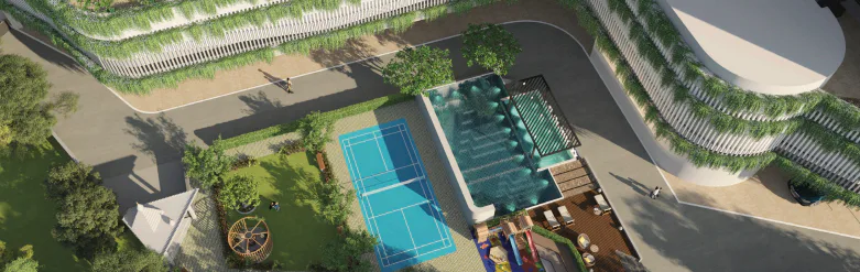 Aerial view of the sports court, pool and green facade at Rustomjee Urban Woods, Dombivli East