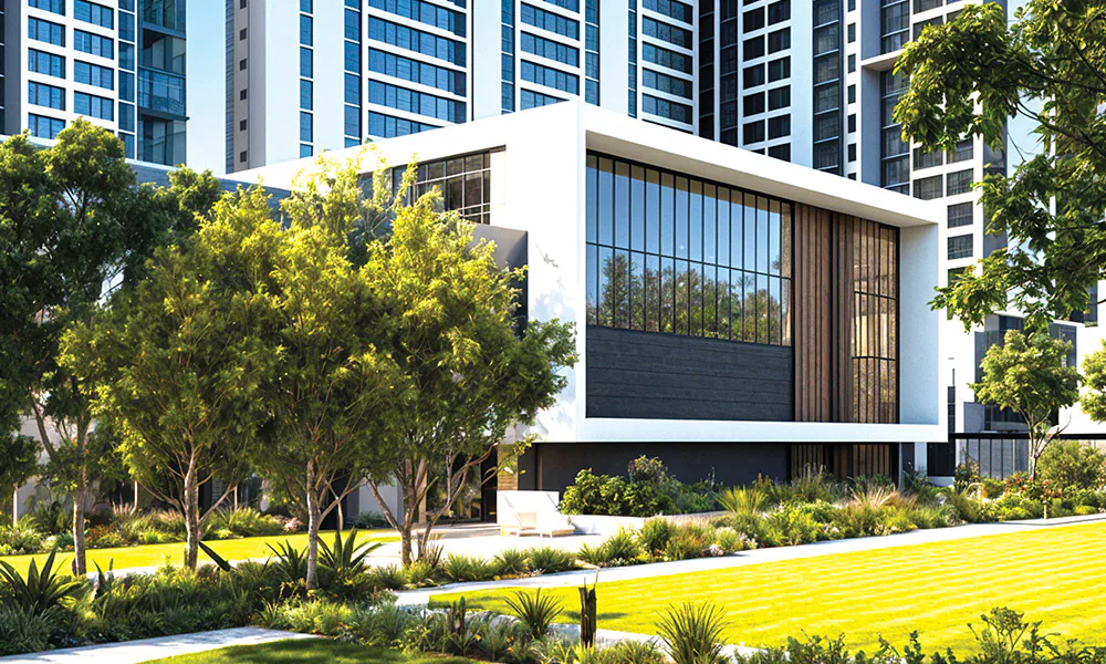 Clubhouse facade with mature trees and lawn at Rustomjee Urban Woods, Dombivli East