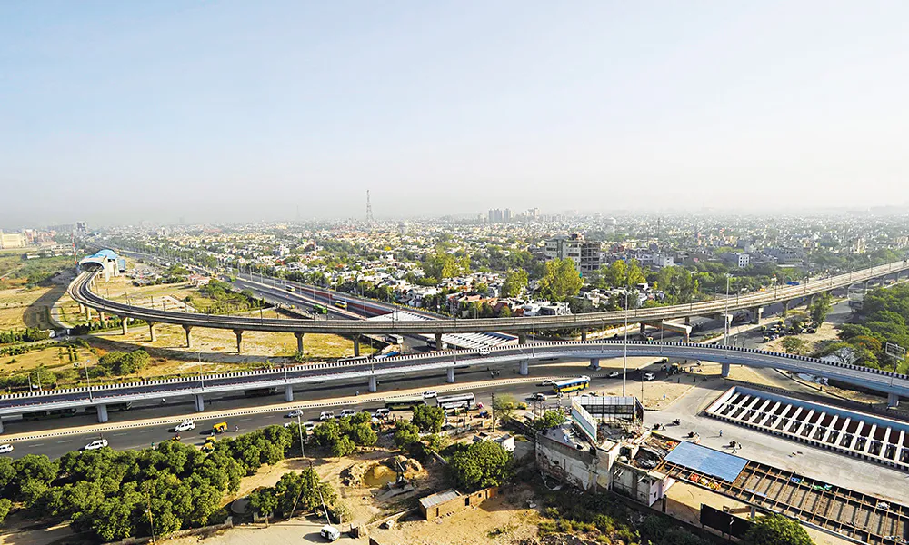 Aerial view of the flyover interchange and arterial roads serving the Kalyan-Shilphata corridor near Rustomjee Urban Woods